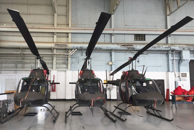 Three OH-58 Kiowa helicopters stand ready to bid farewell to active service on July 9. The retiring helicopters were flown by eight 1st Bn, 5th Avn Reg, pilots in a “V” formation in the Fort Polk and Leesville airspace, making two figure eights during their flight.