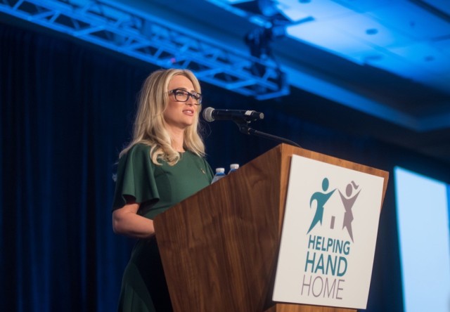 Christina Meredith speaks during the Helping Hand Home for Children luncheon.  As a survivor of sexual, physical, and emotional abuse and homelessness, Meredith discussed how she found strength in her faith as she continued to find ways to help others.