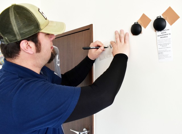 Brandon Crawford, an environmental scientist with the Environmental Science Corporation of Tokyo, prepares to remove radon detection devices from a home at Sagamihara Family Housing Area, Japan, Jan. 13, 2020.