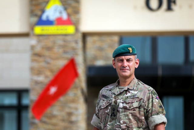British Army Brig. Gen. Leigh Tingey, the deputy commanding general-maneuver of 1st Armored Division, poses in front of the 1AD headquarters at Fort Bliss, Texas, July 1. Tingey has served as the 1AD DCG-M since 2018 and has recently completed a...