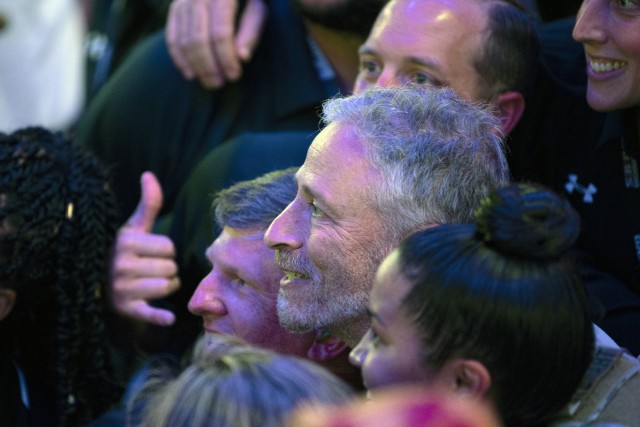 Entertainment personality Jon Stewart has his picture taken with athletes competing in the 2019 DoD Warrior Games during opening ceremonies in Tampa, Florida June 22, 2019. (DoD photo by EJ Hersom)