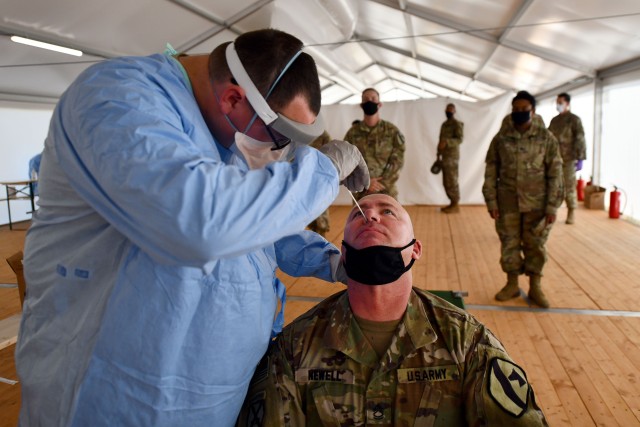 A Soldier receives a COVID-19 test as part of a preventative measure during Phase II of DEFENDER-Europe 20, July 15, 2020,  in Drawsko Pomorskie Training Area, Poland. In response to the virus, DEFENDER-Europe 20 was modified in size and scope. The Army is considering adjustments to its fiscal year 2022 budget request, as senior leaders look to invest in the service’s ability to fight against infectious diseases. 