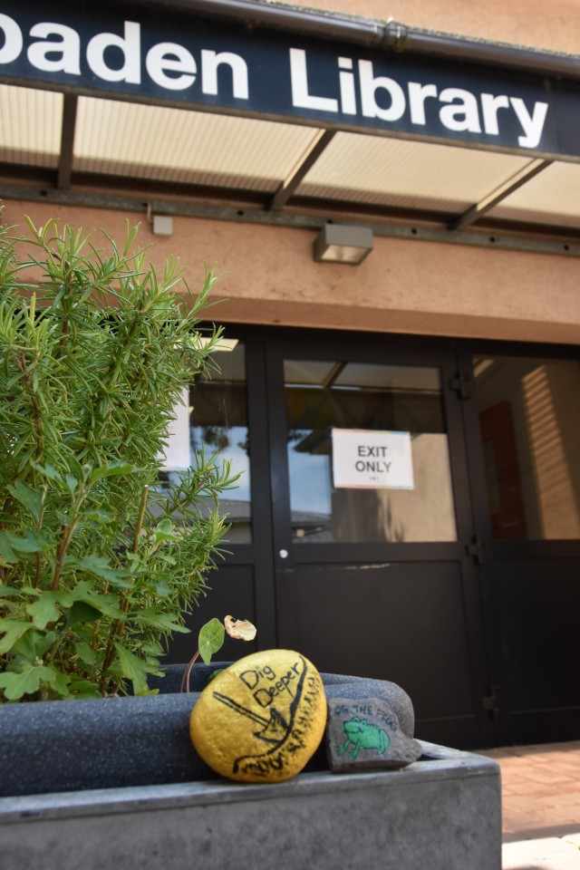 WIESBADEN, Germany – Painted rocks sit outside the Wiesbaden Library July 14, 2020. The rocks are part of a challenge in the virtual summer reading program where families can paint rocks and hide them around the community for others to find....