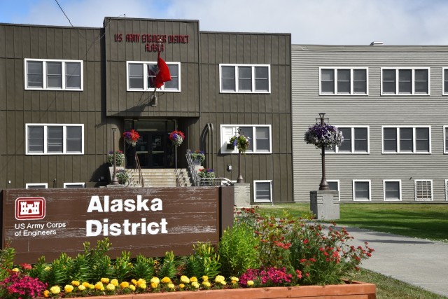 Workers completed the front of the Alaska District’s headquarters at the end of June. The first exterior update since the late 1970’s features an “adaptive shade” for the main color, a “creamy” trim around the windows, an “enduring bronze” around the main entrance and “positive red” for signage.
