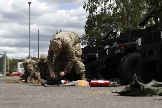 Members of headquarters and headquarters company, 361st Civil Affairs Brigade. 7th Mission Support Command, conduct vehicle equipment layout and inventory prior to a change of command ceremony in Kaiserslautern, Germany, June 7, 2020. The ceremony was conducted in person and virtually to protect the force and enable maximum participation for Soldiers, friends and family members. (U.S. Army Reserve photo by Staff Sgt. Chris Jackson/Released)
