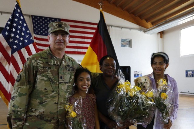 Lt. Col. Frank Suyak and family pose after taking command of the 209th Digital Liaison Detachment July 19, 2020 in Wackernheim, Germany. The detachment, headquartered at U.S. Army Garrison Wiesbaden, is part of the U.S. Army Reserve’s 7th Mission Support Command and serves in direct support of U.S. Army Europe.  (U.S. Army Reserve photo by Staff Sgt. Chris Jackson/Released)
