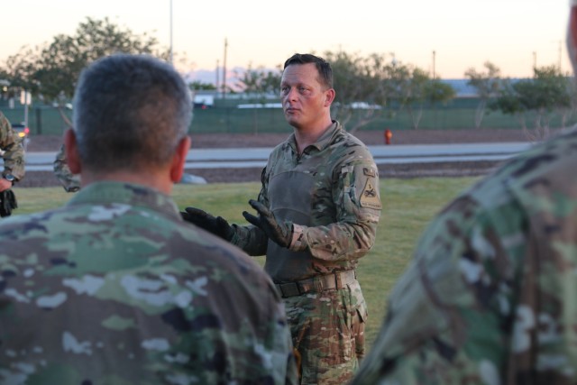 Command Sgt. Maj. Robert H. Cobb, senior enlisted leader of the 1st Armored Division and Fort Bliss, talks with his sergeant majors after conducting a physical fitness team building event Oct. 25, 2018 at Fort Bliss, Texas.