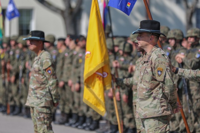 U.S. Army Command Sgt. Maj. Marcus Brister, assigned to 3rd Squadron, 2nd Cavalry Regiment, stands at parade rest in front of a formation during a change of command ceremony in Bemowo Piskie Training Area, Poland, July 17, 2020. Brister, the outgoing command sergeants major of Battle Group Poland, was replaced by Sgt. Maj. Keneti Pauulu from 2nd Squadron, 2nd Cavalry Regiment. (U.S. Army photo by Cpl. Justin W. Stafford)