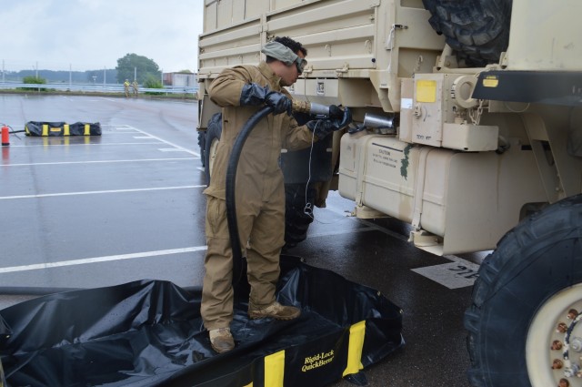 Spc. Nathaniel Holmes, petroleum supply specialist, 493rd Petroleum Supply Company, 18th Combat Sustainment Support Battalion, 16th Sustainment Brigade, 21st Theater Sustainment Command, refuels a truck after it was offloaded from a train July 16, 2020, during the largest rail operation U.S. Army Garrison Ansbach, Germany, conducted in more than 10 years. The trucks and equipment belong to the 101st Combat Aviation Brigade, the incoming Regionally Allocated Force that will be stationed at Storck Barracks, Illesheim, for their nine-month rotation supporting Atlantic Resolve. The Katterbach Railhead provides U.S. Army in Europe an additional power projection platform capability to deploy arriving and departing brigade-size elements to meet strategic objectives.