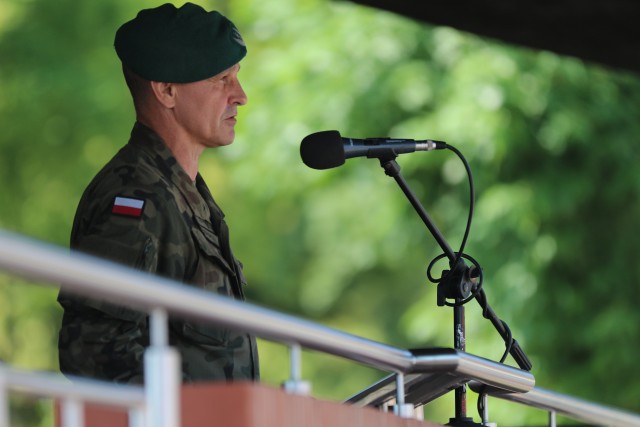 Polish Land Forces Col. Bogdan Rycerski, 15th Mechanized Brigade commander, speaks during a change of command ceremony in Bemowo Piskie Training Area, Poland, July 17, 2020. After a 6-month rotation, 3rd Squadron, 2nd Cavalry Regiment was replaced by 2nd Squadron, 2nd Cavalry Regiment. (U.S. Army photo by Cpl. Justin W. Stafford)