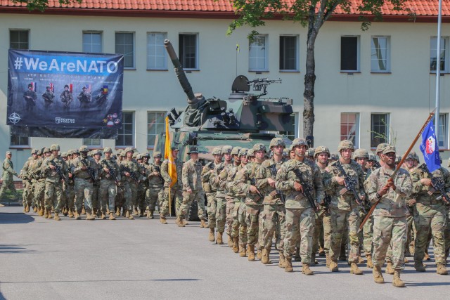 U.S. Army Soldiers assigned to 2nd Cavalry Regiment march during the pass in review portion at a change of command ceremony in Bemowo Piskie Training Area, Poland, July 17, 2020. After a 6-month rotation, 3rd Squadron, 2nd Cavalry Regiment was replaced by 2nd Squadron, 2nd Cavalry Regiment. (U.S. Army photo by Cpl. Justin W. Stafford)