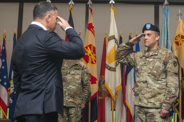 Col. Noah C. Cloud, U.S. Army Garrison Wiesbaden outgoing commander, transfers his authority to Tommy R. Mize, Installation Management Command Directorate-Europe director, during a change of command ceremony at Clay Kaserne, July 17, 2020. To...