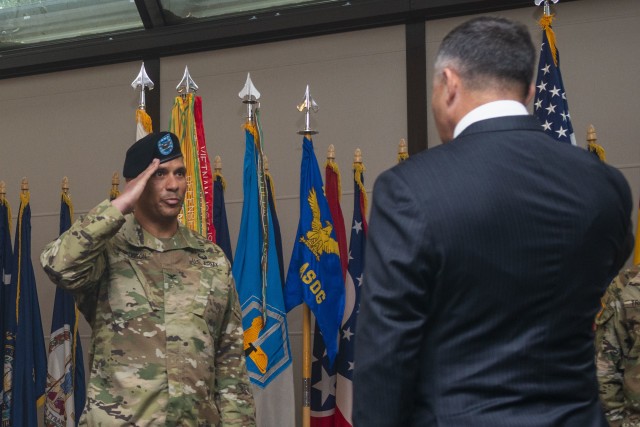Col. Mario Washington, U.S. Army Garrison Wiesbaden incoming commander assumes authority of the garrison from Tommy R. Mize, Installation Management Command Directorate-Europe director during a change of command ceremony at Clay Kaserne, July 17,...