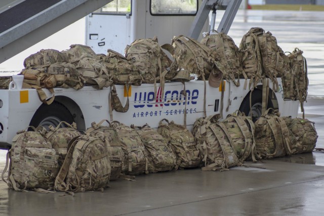 Bags sit on the flight line as Soldiers with 2nd Battalion, 12th Cavalry Regiment, 1st Armored Brigade Combat Team, 1st Cavalry Division, arrived in Poznan, Poland, July 16, 2020. The Fort Hood based unit deployed to participate in DEFENDER-Europe 20 Phase II at Drawsko Pomorskie Training Area, Poland. DEFENDER-Europe 20 was designed as a deployment exercise to build strategic readiness in support of the U.S. National Defense Strategy and NATO deterrence objectives. In response to COVID-19, DEFENDER-Europe 20 was modified in size and scope. Phase I of the modified DEFENDER-Europe 20 was linked exercise Allied Spirit, which took place at Drawsko Pomorskie Training Area, Poland, June 5-19, with approximately 6,000 U.S. and Polish Soldiers. In Phase II of the modified DEFENDER-Europe 20, a U.S.-based combined arms battalion will conduct an Emergency Deployment Readiness Exercise to Europe July 14 – Aug. 22. For more information about DEFENDER-Europe, visit www.eur.army.mil/DefenderEurope. (Photo curtesy of the U.S. Army)