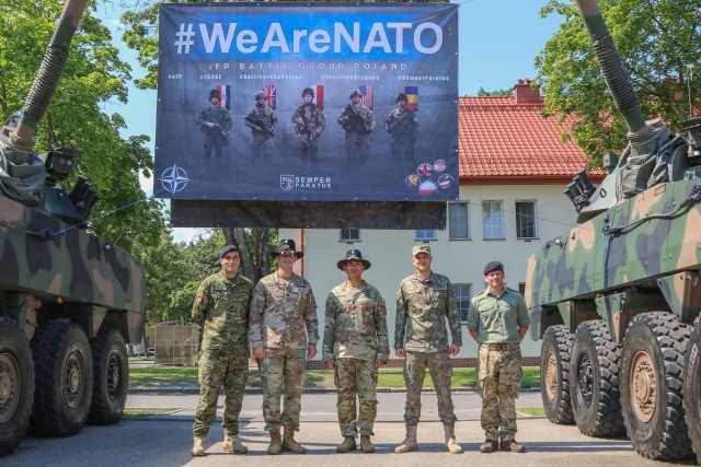 Commanders from the Croatian, Romanian, and U.K. Battle Group Poland contingents stand alongside Lt. Col. Jeffery Higgins, the incoming battle group commander, and Command Sgt. Maj. Keneti Pauulu, the incoming command sergeants major, during a change of command ceremony in Bemowo Piskie Training Area, Poland, July 17, 2020. After a 6-month rotation, 3rd Squadron, 2nd Cavalry Regiment was replaced by 2nd Squadron, 2nd Cavalry Regiment. (U.S. Army photo by Cpl. Justin W. Stafford)