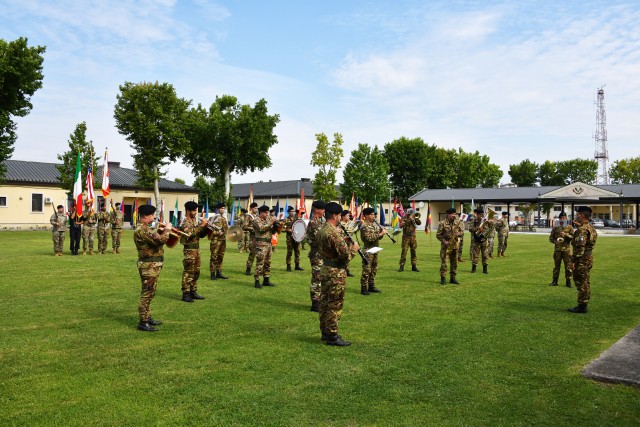 The Italian army fanfare of the cavalry brigade, “Pozzuolo del Friuli,” is conducted by Italian army Sgt. Cosimo Taurisano, far right, during the U.S. Army Africa change of command ceremony at Caserma Ederle in Vicenza, Italy, July 15, 2020....