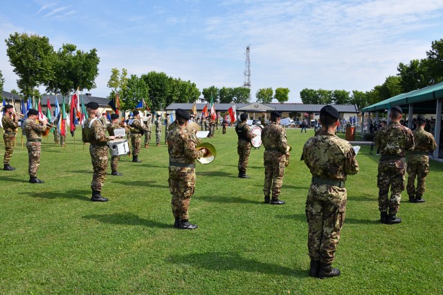The Italian army fanfare of the cavalry brigade, “Pozzuolo del Friuli,” conducted by Italian army Sgt. Cosimo Taurisano, is played during the U.S. Army Africa change of command ceremony at Caserma Ederle in Vicenza, Italy, July 15, 2020. Maj....