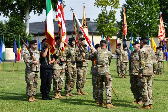 Maj. Gen. Andrew M. Rohling the incoming U.S. Army Africa commanding general, left, passes the unit colors to USARAF Command Sgt. Maj. Charles W. Gregory during the change of command ceremony held at Caserma Ederle in Vicenza, Italy, July 15,...