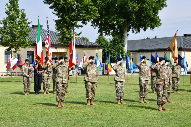 Col. John Harris, the U.S. Army Africa troop commander, front right, leads USARAF Soldiers in a salute to the flags during the USARAF change of command ceremony July 15, 2020, on Caserma Ederle in Vicenza Italy. Maj. Gen. Andrew M. Rohling assumed...