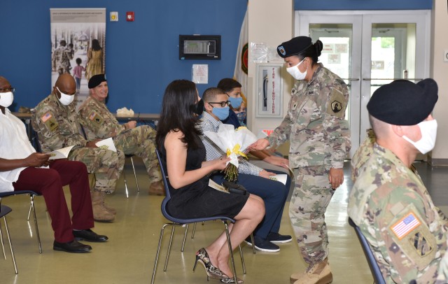 During the virtual and live streamed, U.S. Army Garrison Fort Buchanan Change of Responsibility Ceremony held at the Maj. Gen. Félix A. Santoni Reserve Center in Fort Buchanan, July 14, 2020 Incoming Command Sgt. Maj. Banks spouse, Carolina Banks...