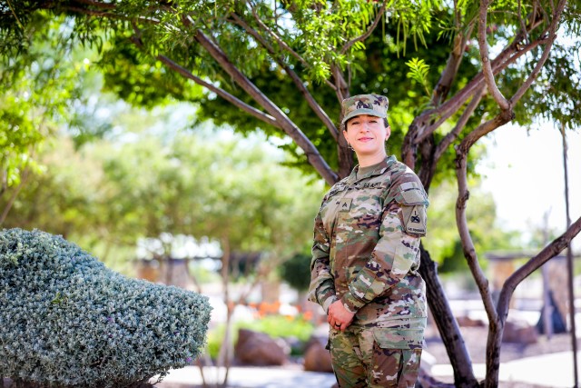FORT BLISS, Texas -  Cpl. Caitlin Brody, a musician and french horn player assigned to the 1st Armored Division Band and native of Albuquerque, New Mexico, poses before a ceremony at Fort Bliss, Texas, July 16. Brody won the Army Band Active Component Soldier of the Year recognition, being nominated from among 19 1AD Band Soldiers and winning the competition by beating out 275 other active duty Army Band Soldiers, demonstrating the technical skill and excellence that defines the Army Band. (U.S. Army photo by Pfc. Matthew Marcellus)