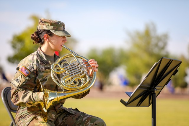 FORT BLISS, Texas - Cpl. Caitlin Brody, a musician assigned to the 1st Armored Division Band and native of Albuquerque, New Mexico, plays the french horn while attending a ceremony at Fort Bliss, Texas, July 16. Brody won the Army Band Active Component Soldier of the Year award this year, beating out 275 other active duty Army Band Soldiers, demonstrating her leadership, technical excellence and superior Soldier skills. (U.S. Army photo by Pfc. Matthew Marcellus)