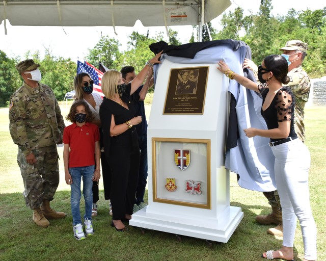 The family of the late Command Sgt. Maj. Wilfredo Vélez Flores of the Puerto Rico Army National Guard, Garrison Command Sgt. Maj. Heriberto Quintana and State Command Sgt. Maj. Andrés Ruiz, unveiled the plaque in his honor at the Memorialization...