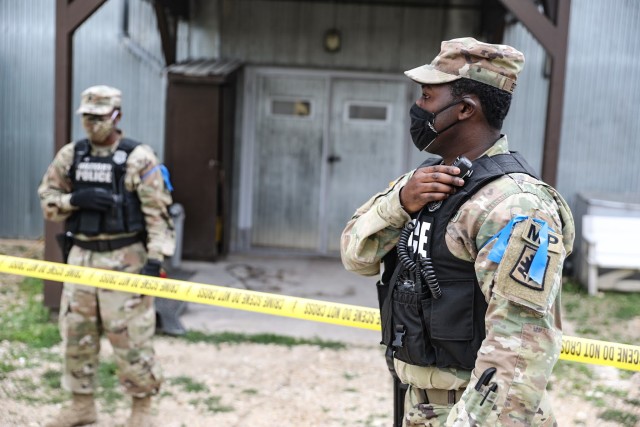 1st Lt. Kasiym Bethea, Task Force Military Police Commander and duty officer in charge, communicates with higher echelons after securing the scene during active shooter training at Camp Bondsteel, Kosovo, July 18, 2020. Task Force Military Police...