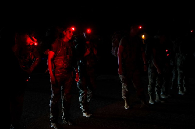 FORT BLISS, Texas - Iron Soldiers assigned to 1st Armored Division prepare to begin a 12-mile ruck march as part of the 1AD Best Warrior Competition, May 15. The competitors each had to carry a 35-pound rucksack over a predetermined course at Fort...