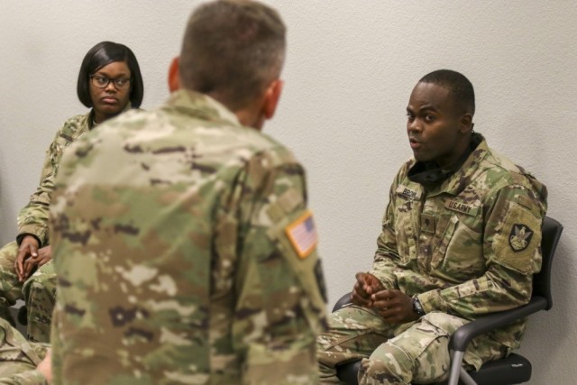 Lt. Gen. Daniel Karbler, center, commander of Army Space and Missile Defense Command, meets with Soldiers at Fort Carson, Colo., June 29, 2020, to discuss diversity and inclusion. Army senior leaders hosted a virtual town hall July 22 to address how to combat sexual harassment and assault, as well as racial injustice. 