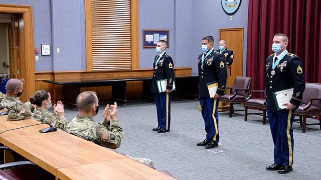 Leaders and family members applaud Sergeant Audie Murphy Club inductees Sgt. 1st Class Matthew Wilson, 291st MP Company, 40th Military Police Battalion (Detention); Staff Sgt. Alejandro Amaya, 526th MP Company, 40th; and Staff Sgt. Paul Michaud,...