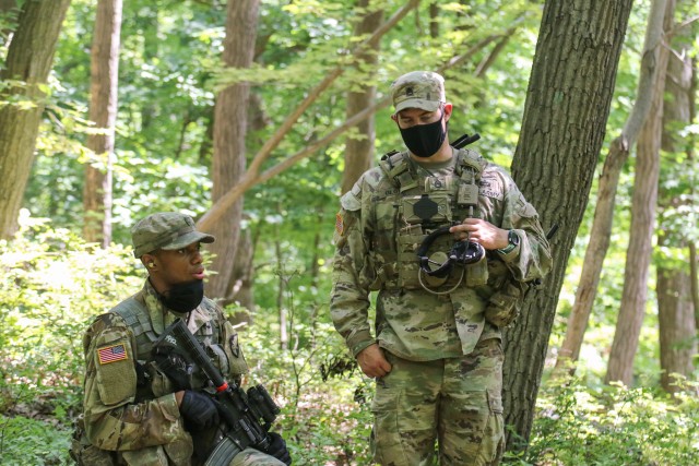 Staff Sgt. Seth Glover (right), 2nd Security Force Assistance Brigade, instructs U.S. Military Academy cadets during introduction to patrolling drills July 14 as part of Cadet Field Training.