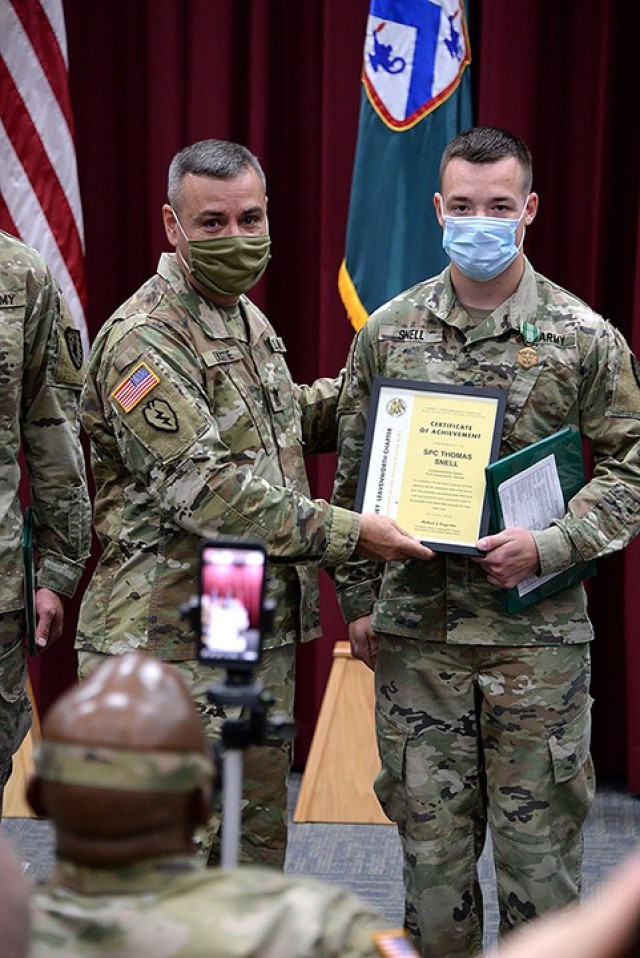 Combined Arms Center Command Sgt. Maj. Eric Dostie recognizes CAC and Fort Leavenworth Soldier of the Year Spc. Thomas Snell, 165th Military Police Company, 705th MP Battalion (Detention), during a ceremony broadcast on Facebook by 40th MP...