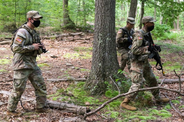 Staff Sgt. Seth Glover (left), 2nd Security Force Assistance Brigade, instructs U.S. Military Academy cadets during introduction to patrolling drills July 14 as part of Cadet Field Training.