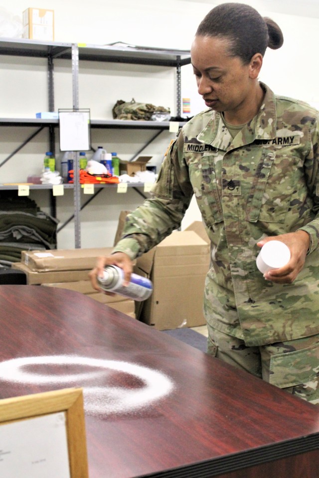 Sgt. 1st Class Kimberly Middleton with Regional Training Site-Maintenance cleans a classroom area July 16, 2020, in building 1370 at Fort McCoy, Wis. The Regional Training Site-Maintenance staff resumed their institutional training courses in July...