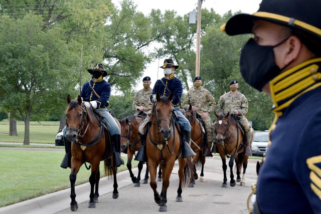 On July 16, 2020, U.S. Army Garrison Fort Riley hosted a change of command ceremony between Col. Stephen Shrader and Col. William B. McKannay.  The official party arrived on horseback to commemorate the history of Fort Riley’s cavalry role on the plains.