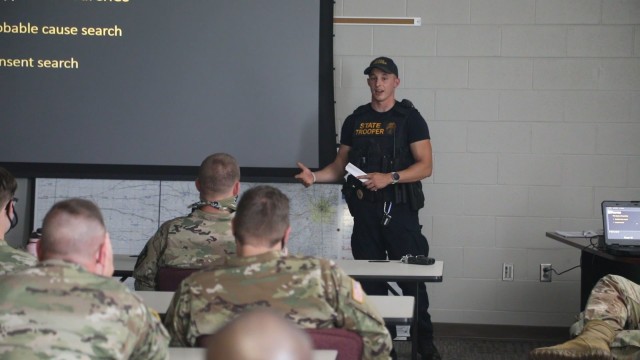 Soldiers of Kansas Army National Guard 35th Military Police Company, 891st Engineer Battalion, 635th Regional Support Group received training from Technical Trooper Derek Carr on Kansas Highway Patrol tactics for reasonable suspicion, probable...