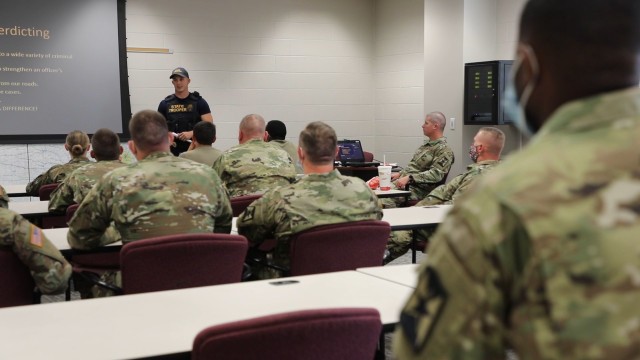 Soldiers of Kansas Army National Guard 35th Military Police Company, 891st Engineer Battalion, 635th Regional Support Group received training from Technical Trooper Derek Carr on Kansas Highway Patrol tactics for reasonable suspicion, probable...