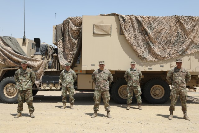 U.S. Army Cpt. Patrick Shuart stands with his Soldiers that were promoted in Kuwait on May 16, 2020. Shuart commands the 42nd Infantry Division's Headquarters Support Company. (U.S. Army photo by Sgt. Trevor Cullen)