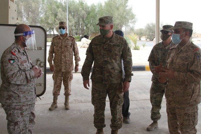 U.S Army Soldiers of the 75th Field Artillery Brigade and Kuwaiti Army Soldiers stand together in Kuwait, July 15, 2020. The Kuwaiti Soldiers were meeting with the commander of the 75th FA to showcase their capabilities and plan future exercises....