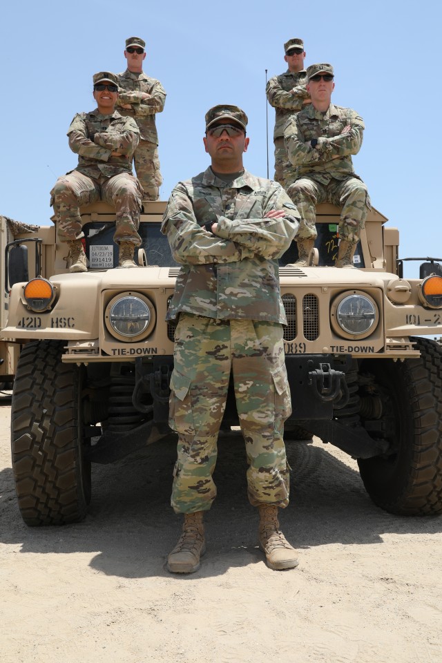 U.S. Army Commanders from the 42nd Infantry Division's Headquarters and Headquarters Battalion stand together in Kuwait May 16, 2020. Shuart commands the 42nd HHBN's Headquarters and Support Company. (U.S. Army photo by Sgt. Trevor Cullen)