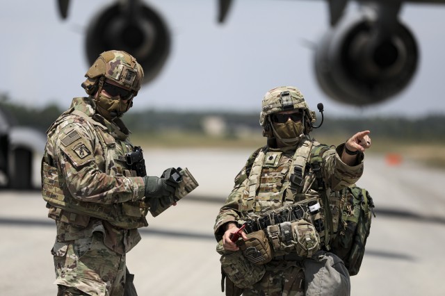Lt. Col. John Bradley, commander, 3rd Battalion, 27th Field Artillery Regiment (HIMARS), directs personnel after disembarking from a C-17 Globemaster III, in Fort A.P. Hill, Virginia, for an artillery raid exercise on July 20, 2020. Crews from the...