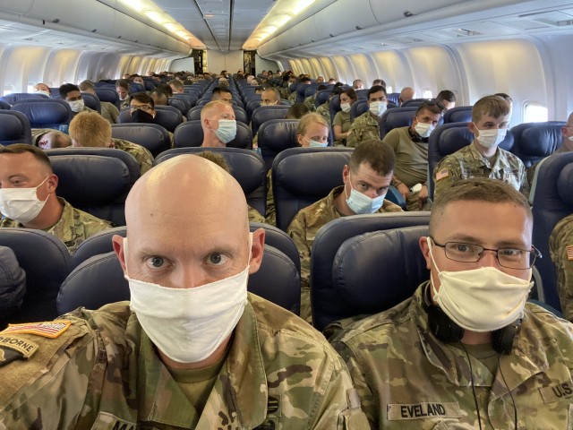 Soldiers from the U.S. Army Reserve’s 652nd Regional Support Group out of Helena, Montana, and the New Mexico National Guard’s 1209th Medical Company (Area Support) from Rio Rancho, New Mexico, prepare to take off from Poznan, Poland, en route...