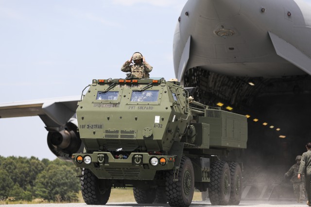 Crewmembers assigned to 3rd Battalion, 27th Field Artillery Regiment (HIMARS), unload a M142 High Mobility Artillery Rocket System, from a C-17 Globemaster III, en route to a simulated firing mission, at Fort A.P. Hill Landing Zone, Virginia, July 20, 2020. These 3-27th FAR (HIMARS) crews are conducting simulated Artillery Raids in preparation for taking on the immediate reaction force (IRF) mission.
(U.S. Army Photo by Spc. Daniel J. Alkana, 22nd Mobile Public Affairs Detachment)
