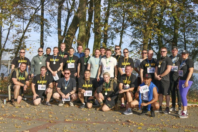 U.S. Army Reserve Soldiers from the 652nd Regional Support Group out of Helena, Montana, pose together for a group photo after participating in a 5K race October 20 in the town of Powidz, Poland. The race benefitted Julia Kapczynski, an infant from Powidz who is battling numerous health and developmental issues. (U.S. Army Reserve photo by Master Sgt. Ryan C. Matson, 652nd Regional Support Group)