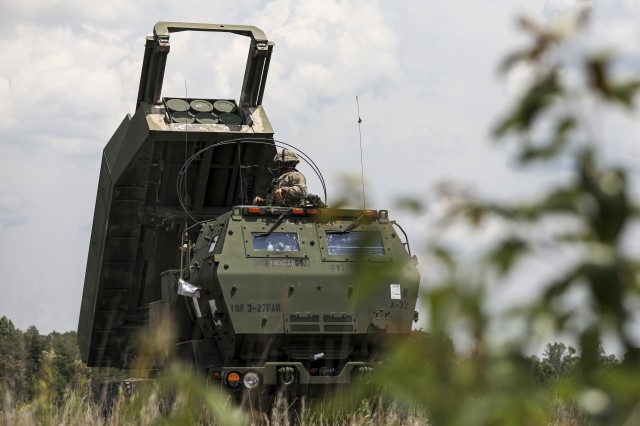 U.S. Army Sgt. Jacob Ramirez, a multiple launch rocket system (MLRS/HIMARS) crewmember, assigned to 3rd Battalion, 27th Field Artillery Regiment (HIMARS), raises a M142 High Mobility Artillery Rocket System, to simulate accuracy of live rounds, at Fort A.P. Hill Landing Zone, Virginia, July 20, 2020. These 3-27th FAR (HIMARS) crews are conducting simulated Artillery Raids in preparation for future large scale combat operations.
(U.S. Army Photo by Spc. Daniel J. Alkana, 22nd Mobile Public Affairs Detachment)
