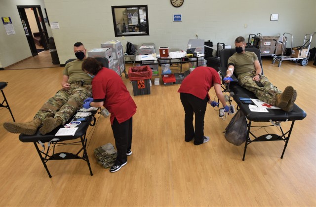 Drawing on support — Garrison leaders donate blood at American Red Cross event