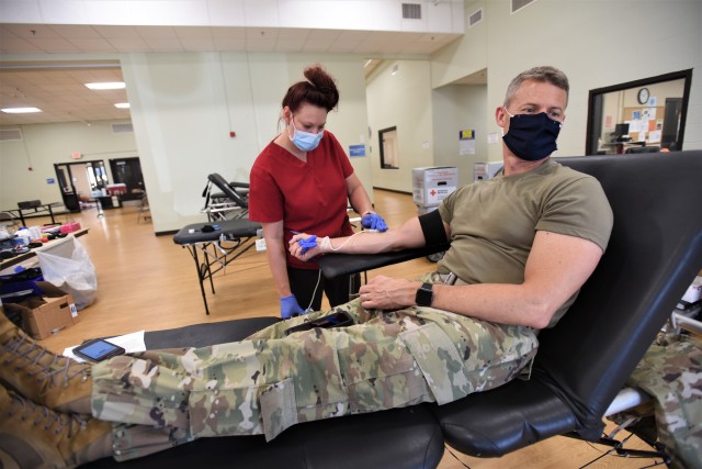 Drawing on support — Garrison leaders donate blood at American Red Cross event