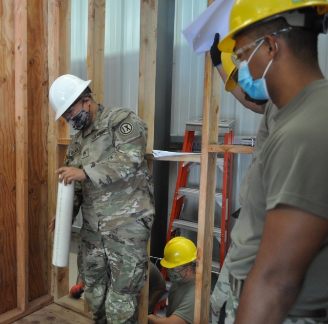 SSG Holden Agcaoili, Senior Instructor for the Interior Plumbing Re-Class Course, conducts a demonstration for the students at the Vertical Skills Building at Fort Shafter Flats, Honolulu, Hawaii July 28, 2020.