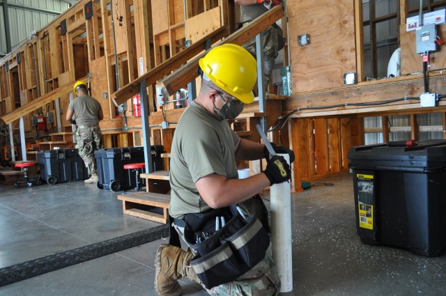 After receiving the demonstration, students in the Interior Plumbing Re-Class Course, work on the specific skill in their individual booths at the Vertical Skills Building at Fort Shafter Flats, Hawaii July 28, 2020.